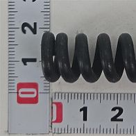 Druckfeder Ø15x48 von Scheppach. Die Feder liegt auf einer Messskala und ist von vorne zu sehen.