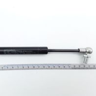 Gasfeder Liftomat von Scheppach, gezeigt von der Seite mit einem Lineal zur Größenveranschaulichung.