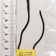 Kondensator 0.47µF / 275V von Scheppach. Der Kondensator liegt auf einer Skala und ist von vorne zu sehen.