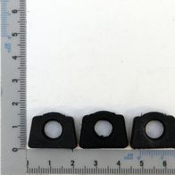 Drei Gummidämpfer aus Kunststoff mit zentralem Loch für mechanische Komponenten