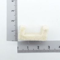 Ein Abstreifer aus Filz, von der Seite betrachtet, neben einem Lineal zur Größenveranschaulichung.