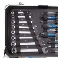 Scheppach TB150 tool kit with 101 pieces. Includes various screwdrivers, nuts, and pliers. Tools are organized in a metal case.