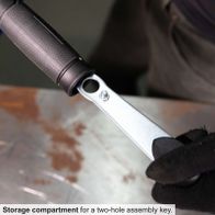 The cordless angle grinder C-WS125BE-X by Scheppach features a storage compartment for a two-hole assembly key.