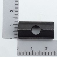Klemmpolster mit zentraler Bohrung, von der Seite betrachtet.