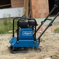 Scheppach vibrating plate compactor with base, frame, and rubber mat, showing engine and drive side