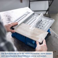 Anpassbare Schutzhaube für verschiedene Materialstärken beim Schneiden