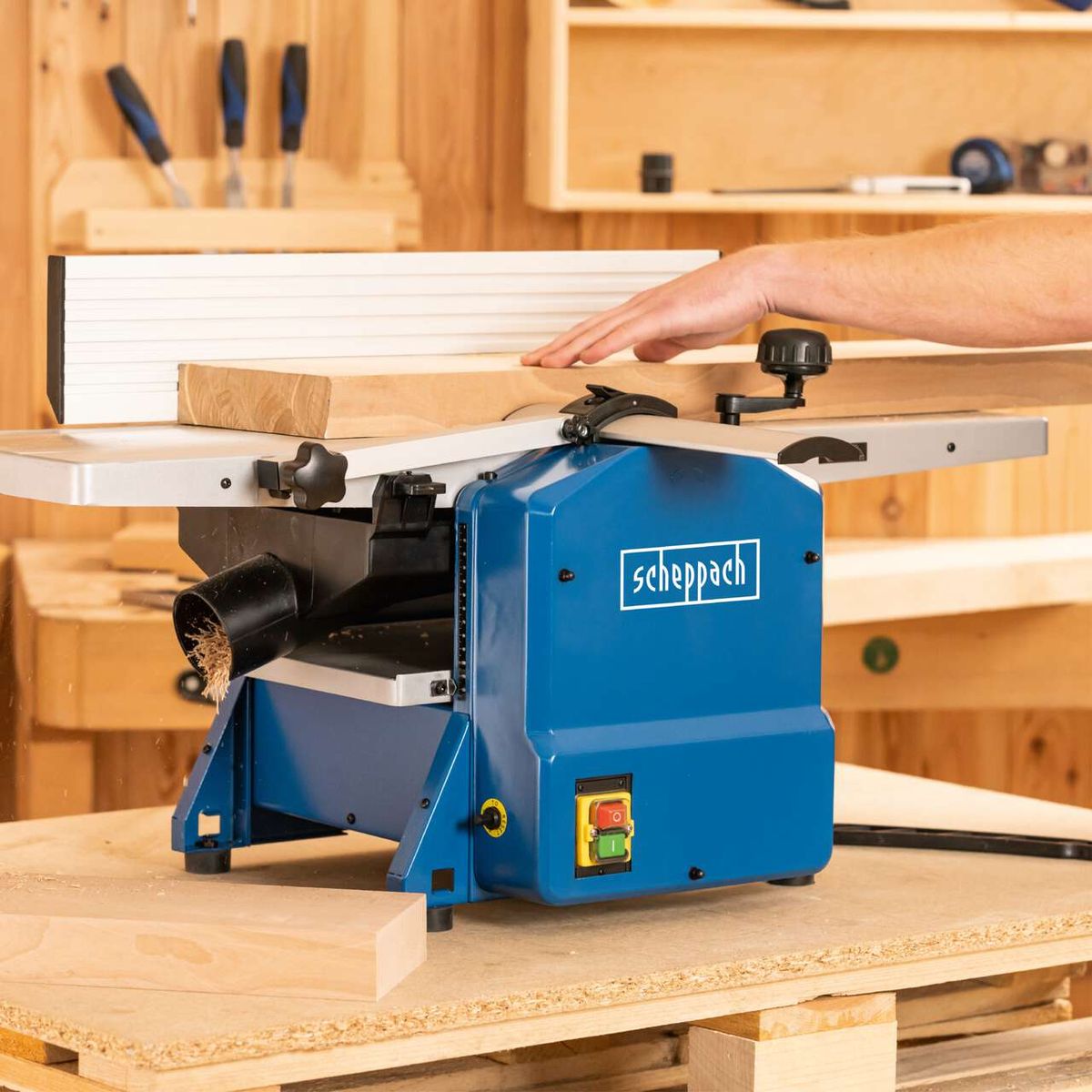 The Scheppach Planer Thicknesser HMS1070 with 1500W power and a planing width of 254mm as well as a maximum planing height of 120mm. The machine features an adjustable fence and a convenient hand crank for height adjustment.