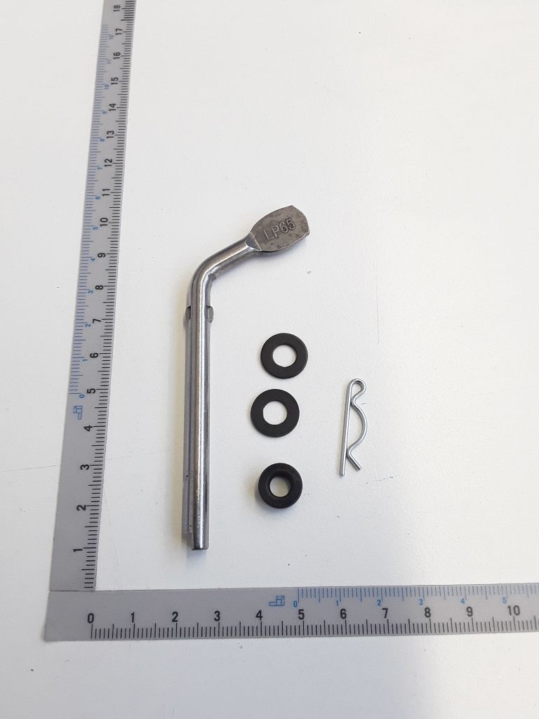 Reglerarm kpl. mit drei schwarzen Scheiben und einer Metallklammer. Der Arm ist etwa 15 cm lang und liegt auf einem Lineal.