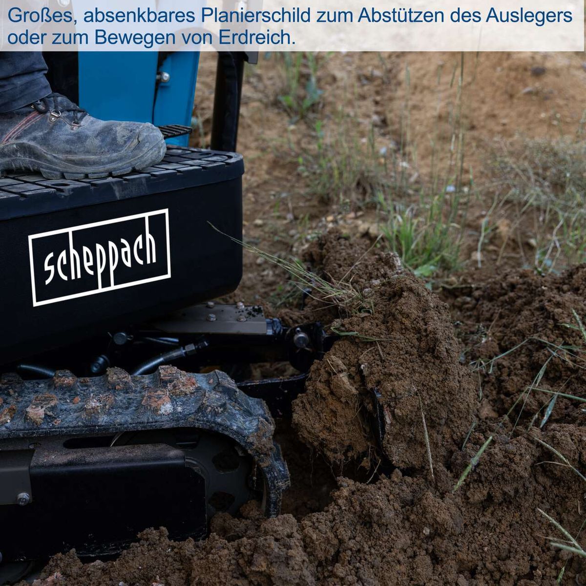 Großes, absenkbares Planierschild zum Abstützen des Auslegers oder zum Bewegen von Erdreich.
