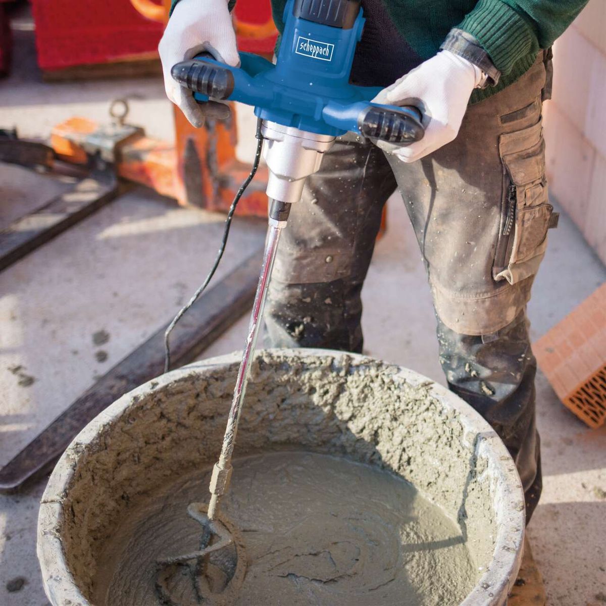 The Scheppach Paddle Mixer PM1400 with 1400W and up to 760RPM variable speed. Includes mortar and paint paddles for mortar, plaster, and paint. Perfect for precise mixing of various materials.