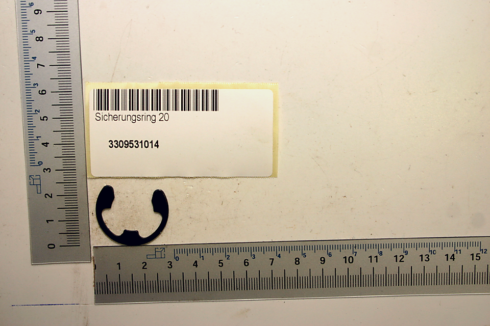 Sicherungsscheibe mit Beschriftung 'Sicherungring 20' und Barcode