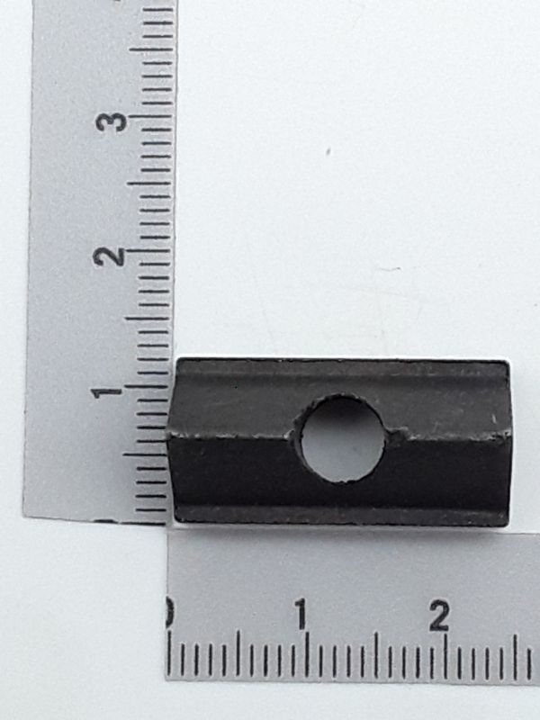 Klemmpolster mit zentraler Bohrung, von der Seite betrachtet.
