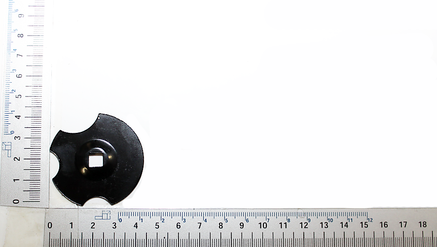 Halterung Sägeblattschutz, Teil 83, von oben gesehen, neben einem Lineal zur Größenveranschaulichung.